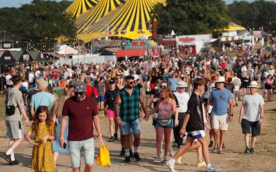 Festivalgoers enjoy the hot weather at Latitude Festival at Henham Park. Reuters