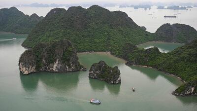 A tourist boat sails on the waters of Ha Long Bay in northeastern province of Quang Ninh, Vietnam. AFP