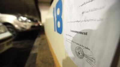 A memo is posted to the first row of parking spaces on Hamdan Street in Abu Dhabi.