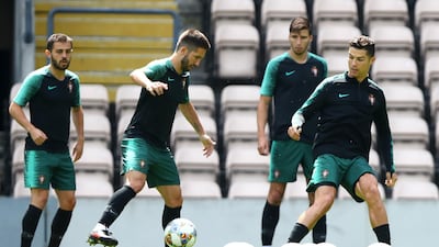 Bernardo Silva, Joao Moutinho and Cristiano Ronaldo of Portugal warm up during training prior to the UEFA Nations League final. Getty Images