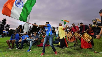 Indian fans cheer on their team during the Under 19 Cricket World Cup final against Australia at Bay Oval in Mount Maunganui on Saturday. Marty Melville / AFP