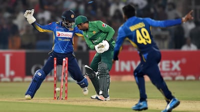 Sarfraz Ahmed was the third wicket to fall in the eighth over bowled by Hasaranga. AFP