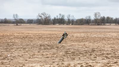 A half-buried, unexploded projectile in the middle of a field near Chernihiv. Getty Images