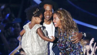 Beyonce smiles with Jay-Z and daughter Ivy Blue after accepting the Video Vanguard Award on stage during the 2014 MTV Video Music Awards in Inglewood, California on August 24, 2014. Lucy Nicholson / Reuters