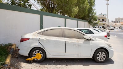 Abandoned cars in Sharjah are impounded to clear the streets and clear parking spaces for motorists. Reem Mohammed / The National
