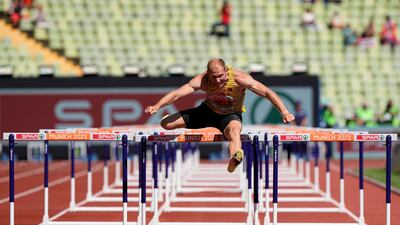 Arthur Abele, of Germany, runs alone in a decathlon 110 metres hurdles heat at the European Championships in Munich. He was disqualified from his original heat, then allowed to run on his own after the decision was revised. AP