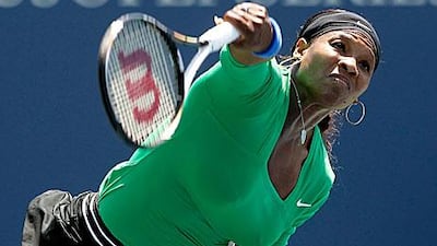 Serena Williams serves to Marion Bartoli during her 7-5, 6-1 victory to take the Bank of the West Classic