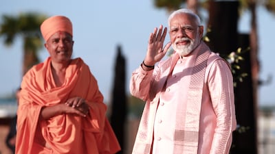 Prime Minister Narendra Modi of India arrives with Sadhu Brahmaviharidas Swami for the inauguration of the Baps Hindu Mandir in Abu Dhabi. All photos: Victor Besa / The National