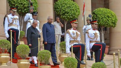 India's new president, Ram Nath Kovind (centre right), accompanied by outgoing president Pranab Mukherjee (centre left), leaves the presidential palace for parliament to attend his swearing-in ceremony in New Delhi on July 25, 2017. India President’s office via AP
