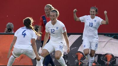 England's Lucy Bronze, centre, celebrates with teammate Fara Williams, left, after scoring the winner in a 2-1 Women's World Cup Round of 16 victory over Norway on Monday. Adrian Wyld / The Canadian Press / AP / June 22, 2015