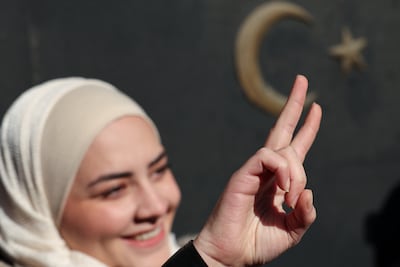 A woman outside the Turkish Embassy, after the fall of Syria's Bashar Al Assad, in Damascus, on December 14. Reuters