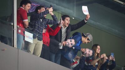 Nacional fans with Luis Suarez masks and posters. EPA