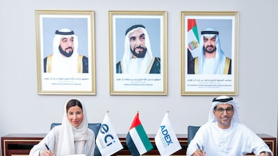 Raja Al Mazrouei, chief executive of ECI and Mohamed Al Suwaidi, director general of ADFD and chairman of the exports executive committee of Adex, during the signing. Photo: Etihad Credit Insurance