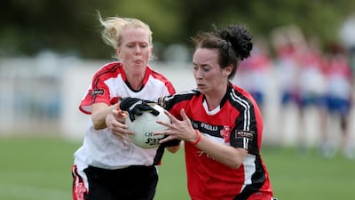 Orla Dohgrty of team Asia 1, right, battles for the ball against Mel Cassidy of Asia 2 during their Gaelic football match in the GAA World Games at Zayed Sports City in Abu Dhabi on March 6, 2015. Christopher Pike / The National