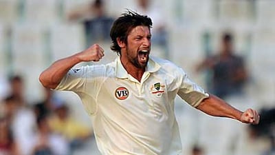 Australian cricketer Ben Hilfenhaus jumps in the air as he celebrates the wicket of India's Virender Sehwag during the fourth day of the first Test.
