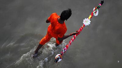 A devotee of the Hindu Lord Shiva arrives to fill his pots with holy water from the river Ganges, in Allahabad. Jitendra Prakash / Reuters