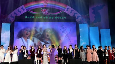 South and North Korean singers sing together during a joint concert at the Ryugyong Jong Ju Yong Gymnasium in Pyongyang, North Korea. Korea Pool via AP
