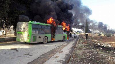 Government buses sent to evacuate wounded and sick people from two villages in Syria’s Idlib province were set on fire on December 18, 2016. Sana via AP