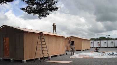 US Navy personnel work on construction of huts at Camp Simba in Lamu in December 2015. EPA