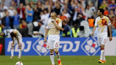 Spain's Andres Iniesta, left, and Spain's Sergio Busquets react after Italy's Graziano Pelle scored during their Euro 2016 round of 16 match at the Stade de France, in Saint-Denis, north of Paris, Monday, June 27, 2016. Italy won 2-0. (AP Photo/Frank Augstein)