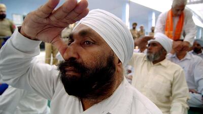 Indian prisoners in a Pune prison can cut their jail terms if they can master some yoga poses and pass a written exam. Narinder Nanu / AFP Photo / 2006 file