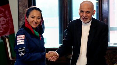 Afghan president Ashraf Ghani shaking hands with Afghan-American female pilot Shaesta Waiz at the presidential palace in Kabul, Afghanistan on July 10, 2017. Ms Waiz, who is on a solo flight around the world to inspire young women, has taken a detour to visit Afghanistan. Afghan Presidential Palace via AP