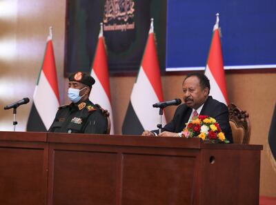 Sudan's Prime Minister Abdalla Hamdok (R) and General Abdel Fattah Abdelrahman Burhan (L) signed a political agreement in Khartoum, on 21 November 2021. EPA