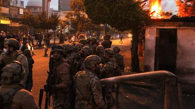 Army soldiers stand guard near the government Serail building during a protest against the lockdown and worsening economic conditions, amid the spread of the coronavirus disease (COVID-19), in Tripoli, Lebanon. Reuters