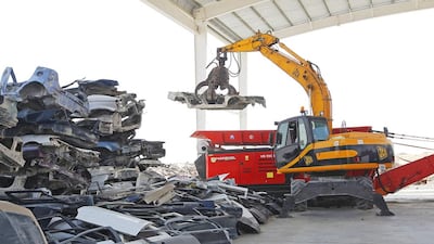 The main purpose of the metal shredding machine, seen in background, is the separation of car bodies and other metal scrap from other materials at the Bee’ah waste management facility in Sharjah. Jeffrey E Biteng / The National