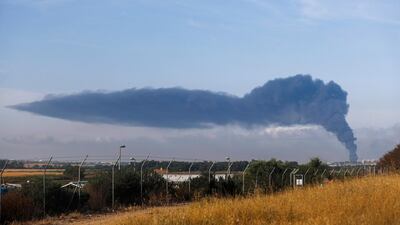 Smoke rises as a result of Israeli air strikes against Hamas targets as seen from the Israeli side of the border to the Gaza strip on 17 May. EPA