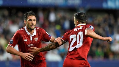 Sevilla’s Argentinian midfielder Franco Vazquez (L) and Sevilla’s Spanish midfielder Vitolo celebrate during the Uefa Super Cup final football match between Real Madrid CF and Sevilla FC on August 9, 2016 at the Lerkendal Stadium in Trondheim. Jonathan Nackstrand / AFP