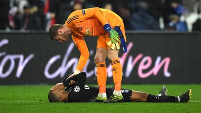 United goalkeeper David De Gea consoles Kylian Mbappe of PSG after the full time whistle.