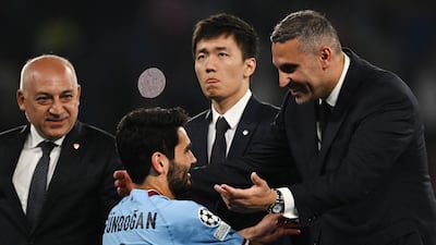 Manchester City chairman Khaldoon Al Mubarak embraces Manchester City's German midfielder Ilkay Gundogan after the team's 1-0 victory over Inter Milan to win the Champions League for the first time in the club's history. AFP