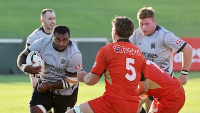UAE suffered a narrow 26-20 loss to Germany, in red, during a Test match at The Sevens in November. Pawan Singh / The National
