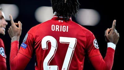 Divock Origi celebrates after scoring the fourth goal, sending Liverpool to the Champions League final. EPA