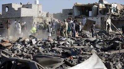 Civil defence workers and people search for survivors under the rubble of houses destroyed by an air strike near Sanaa Airport on March 26, 2015. Khaled Abdullah/Reuters