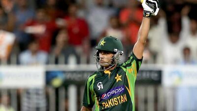 SHARJAH, UNITED ARAB EMIRATES - DECEMBER 18: Mohammad Hafeez celebrates after reaching his century during the first One-Day International (ODI ) match between Sri Lanka and Pakistan at the Sharjah Cricket Stadium on December 18, 2013 in Sharjah, United Arab Emirates. (Photo by Francois Nel/Getty Images)