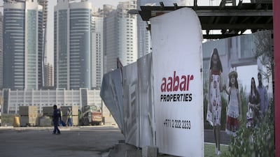 A sign advertising Aabar Properties project hangs on a fence around a construction site on Reem Island in Abu Dhabi Silvia Razgova / The National