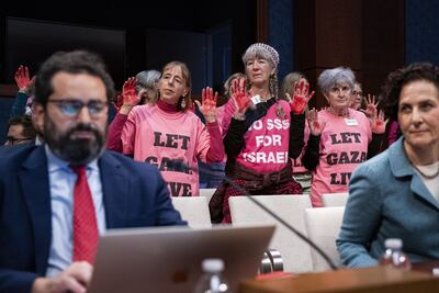 Demonstrators protest during a meeting of the House Foreign Affairs subcommittee in Washington. Bloomberg