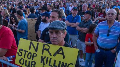 Police said Cruz was a former student at the school. He allegedly returned with a legally owned AR-15 assault rifle, smoke grenades and multiple magazines of ammunition shortly before classes ended. Giorgio Viera / EPA