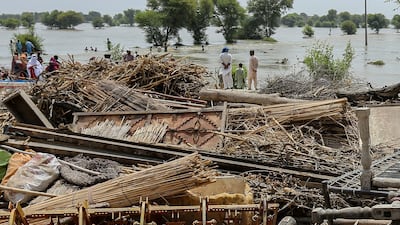 People gather on high ground to escape rising waters