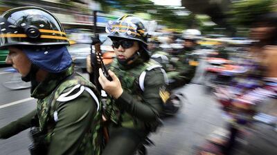 Thai soldiers ride motorcycles to a street near the residence of Thai Prime Minister Abhisit Vejjajiva when news that anti-government protesters had gathered there Sunday April 25, 2010 in Bangkok, Thailand. The embattled prime minister acknowledged he initially underestimated the protesters who have occupied central Bangkok for weeks, but he offered no initiatives Sunday to end the country's prolonged, sometimes bloody political crisis. (AP Photo/Wong Maye-E) *** Local Caption *** XWM102_Thailand_Politics.jpg