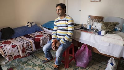 Palanat sits in his room at the cemetery.