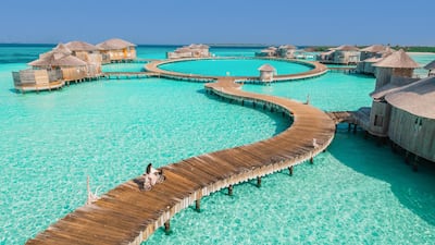 Cycling on the raised boardwalk at Soneva Jani. Photo: Soneva