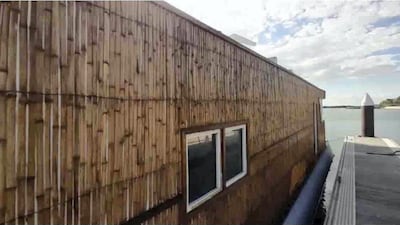 The houseboat sleeps two adults and is pet-friendly