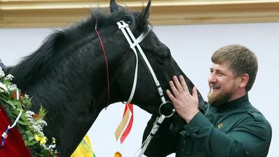 In this file photo Chechen president Ramzan Kadyrov pets his horse Khorezm having watch him race to victory in the President of the Russian Federation Prize race on June 1, 2010 in Rostov-on-Don, Russia. Konstantin Zavrazhin / Getty Images