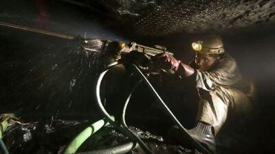 A miner at work in the Impala Platinum mine in Rustenburg, South Africa. Strikes are affecting many of the country's most important sectors, including mining. Nadine Hutton / Bloomberg News