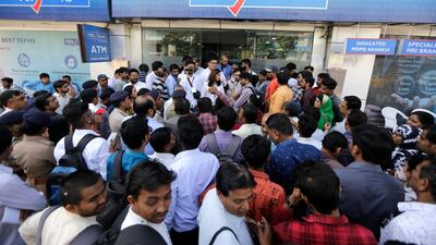 Indian depositors crowd for withdrawals outside a Yes Bank branch in Ahmedabad, India on Friday. India's finance minister assured panicky depositors that their money is safe as the central bank seized control of the private lender. Photo: AP