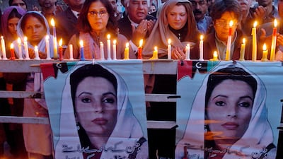 Supporters of the Pakistan People's Party (PPP) hold a candle vigil in the memory of slain former premier Benazir Bhutto in Lahore, on December 31, 2007. Arif Ali / AFP