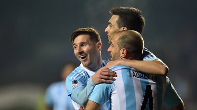 Argentina's Lionel Messi, Javier Pastore and Pablo Zabaleta celebrate during their win on Tuesday night to reach the Copa America final. Yuri Cortez / AFP
